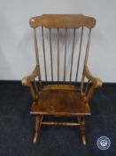A spindle back rocking chair