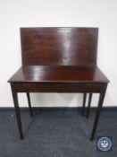 A Victorian mahogany turnover top tea table