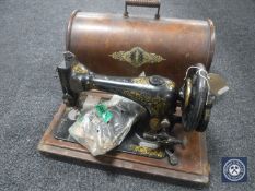 A Singer sewing machine with accessories in case