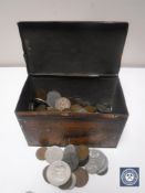 A tin containing a quantity of coins, commemorative crowns etc.
