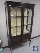 A Victorian mahogany display cabinet on cabriole legs