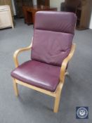 A beech framed armchair in maroon leather