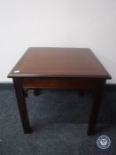 An inlaid mahogany lamp table