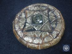 A vintage leather footstool