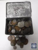 An antique tin containing a quantity of copper and other coins