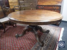 An oval Victorian mahogany tilt top breakfast table