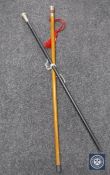 A silver mounted Gentleman's cane together with one further ebonised cane with white metal mount