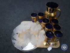 A tray of blue gilt glass jug and goblet set,