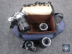A Minolta 1000 and XD7 camera with four lenses.