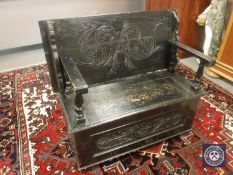 A 19th century stained oak monk's bench,