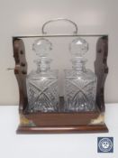 Two bottle cut crystal and mahogany silver plated Tantalus with key CONDITION REPORT: