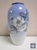 A Royal Copenhagen vase depicting flowers on a branch,