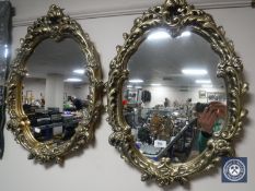 A pair of ornate contemporary mirrors