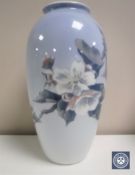 A Royal Copenhagen vase depicting flowers on a branch height 27cm