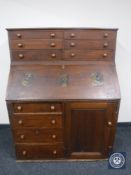 A Victorian pine bureau fitted ten drawers and a cupboard,