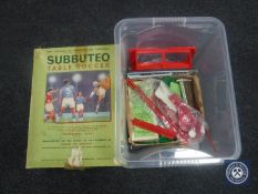 A Subbuteo table soccer game in box together with a crate containing related items,