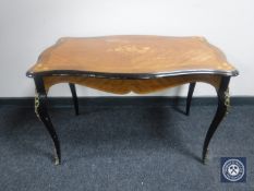 A shaped Kingwood coffee table with gilt metal mounts