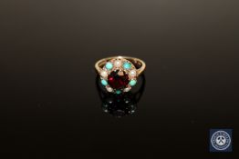 A cluster ring set with seed pearls in yellow 9ct gold, size I.