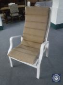 A painted framed armchair