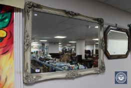 An ornate cream framed mirror