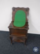 A 20th century oak sewing box with turnover top