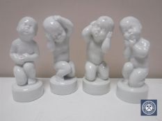 Four Bing & Grondahl figures of children in white glaze, height 11.