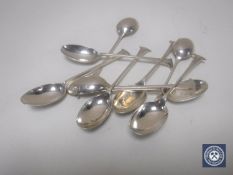 Nine silver teaspoons.