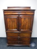 A late 19th century mahogany cocktail cabinet