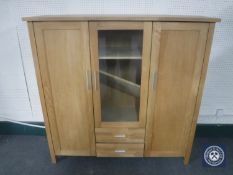 A contemporary oak triple door sideboard