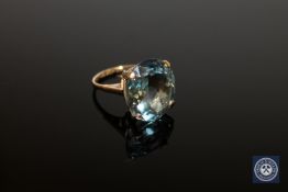 A 9ct gold ring set with a large topaz,
