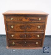 A late nineteenth century continental mahogany four drawer chest with brass handles
