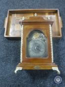 A reproduction mantel clock together with an inlaid wooden tray
