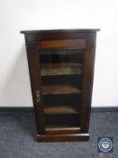 A Victorian glazed door music cabinet