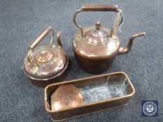 Two antique copper kettles together with a copper trough and dish.