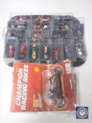 A collection of die cast motorbikes in display cases