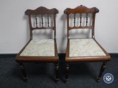A pair of antique mahogany dining chairs
