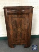 A late 19th century corner cupboard