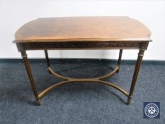 A shaped walnut side table with understretcher with reeded legs CONDITION REPORT: