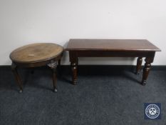 A pine bench together with a circular walnut coffee table