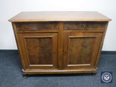 A continental mahogany double door sideboard