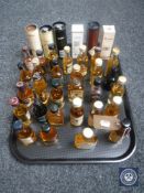 A tray of approximately 35 whisky miniatures