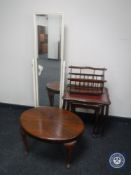 A nest of three mahogany glass and leather topped tables together with a mahogany magazine rack,