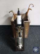 A tea chest containing beer pump, drip tray, bar mats, walking sticks and vintage parasol, flag.