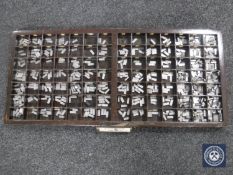 A printers draw containing printing type pieces