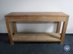 A Barker and Stonehouse side table fitted with three drawers