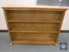 A set of blond oak open bookshelves