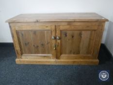An antique pine double door low cabinet