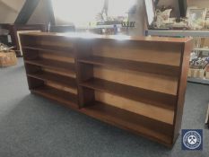A set of mid twentieth century teak open book shelves