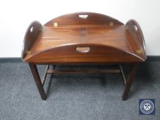A mahogany butler's tray on stand