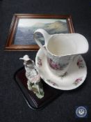 A floral pottery wash jug and basin together with a contemporary Italian figure of a lady on bike